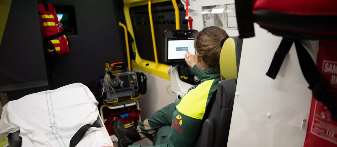 Woman in the back of an ambulance using CSAM Paratus